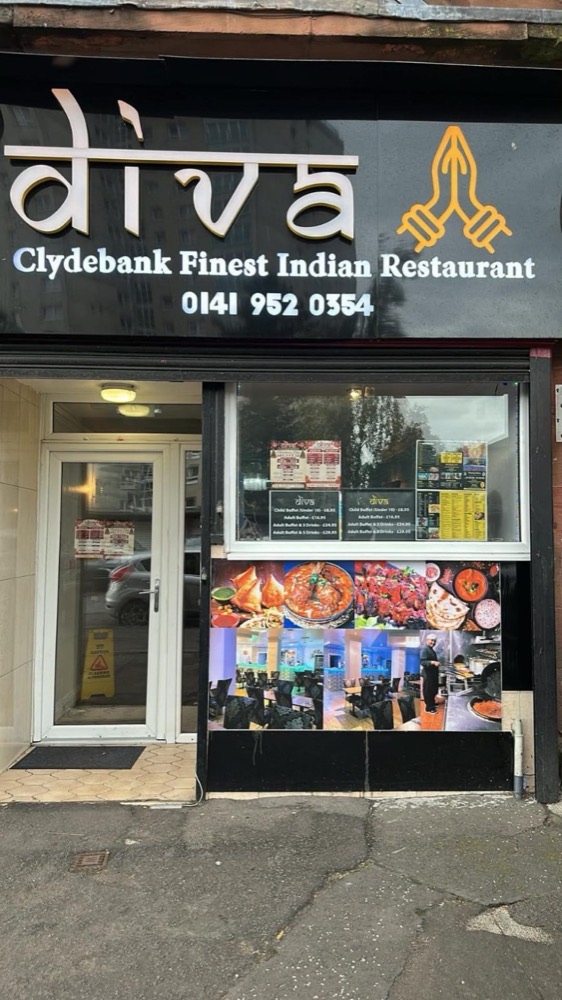 The Diva shopfront on Stewart Street, Clydebank: the lit sign above the door and the buffet prices in the window.